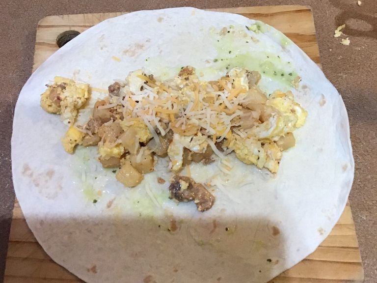 Add mix to tortilla  with cheese 