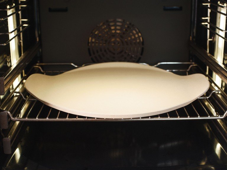 Place pizza stone in unheated oven, then preheat to 250°C/480°F.