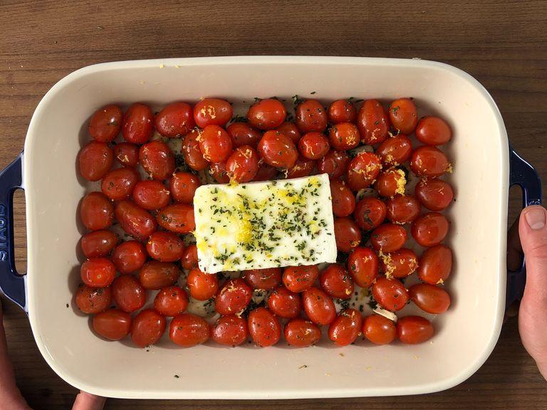Preheat the oven to 200°C/390°F. Add cherry tomatoes, 90 ml olive oil, garlic, most of the thyme, sugar, salt, and pepper in a large baking dish and mix well. Then place feta in the middle of the dish. Drizzle remaining olive oil and sprinkle remaining thyme over feta. Zest lemon over the whole dish. Let bake in the oven for approx. 35 min.