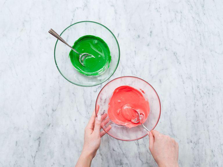 For the icing, add egg whites to a large mixing bowl. Sieve confectioner’s sugar into the bowl, then beat until fluffy and stiff. Divide into three parts and add red and green food coloring to one part each. The third part stays white.