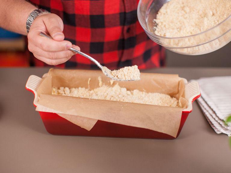 Line loaf pan with parchment paper. Transfer dough into pan and top with crumbs. Bake in preheated oven at 160°C/320°F for approx. 40 - 45 min.