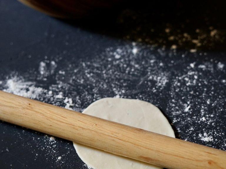 Use a rolling pin to roll out a circle. It’ll be around the size of your palm. Don’t pre-roll all the dough. Roll one and fold one at a time.