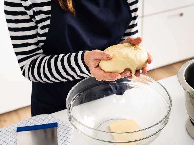 Gradually add in flour and yeast. Transfer dough to a clean bowl, cover with a kitchen towel or plastic wrap, and leave to rise in a warm place for approx. 2 hr., or until doubled in size.