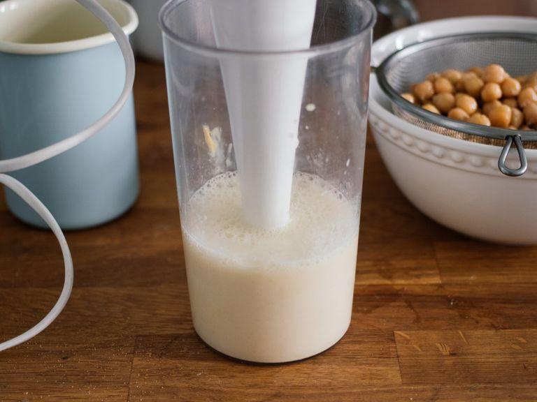Add 7 tbsp of aquafaba, apple cider vinegar, Dijon mustard, and salt to a liquid measuring cup. Use an immersion blender to mix for approx. 1-2 min. until smooth.