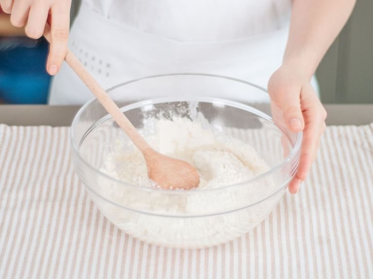 Combine the flour and water in a large mixing bowl. Work into a smooth dough. Set aside.