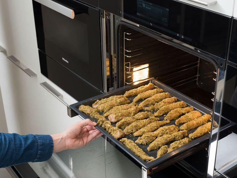 Place the chicken tenders onto the baking sheet and drizzle with olive oil. Transfer to oven at 200°C/400°F for approx. 20 min., or until the chicken tenders are golden brown and the chicken is cooked through. Serve with the blackcurrant dip and enjoy!