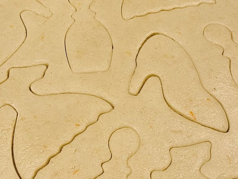 Add a light wash of flour over your counter top and roll out your dough to 1/4 inches thick. The get any style cookie cutter you own and start pressing the shape into the dough.