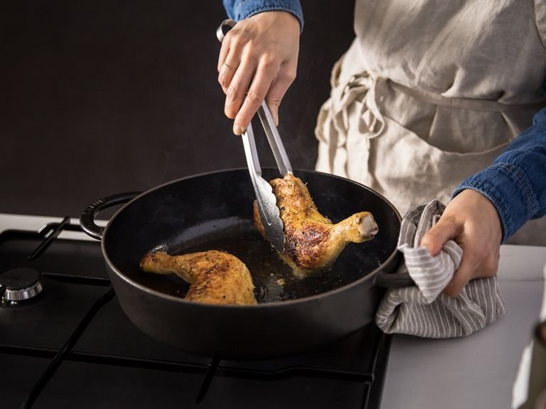 Set a pot over medium-high heat and add a drizzle of olive oil. Add the chicken drumsticks and skin-side down chicken thighs and cook for approx. 12 min. until the skin is crispy and browned. Flip, and cook for approx. 8 min. more. Remove from the pot.