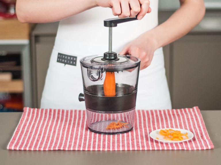 Using a spiral slicer, cut carrot into thin strips.