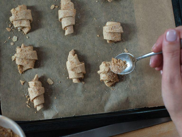 Place mini croissants on baking sheet and top with the rest of the almond-cinnamon mixture. Transfer to oven and bake for approx. 15 – 18 min at 150°C/300°F. Let cool. Enjoy!