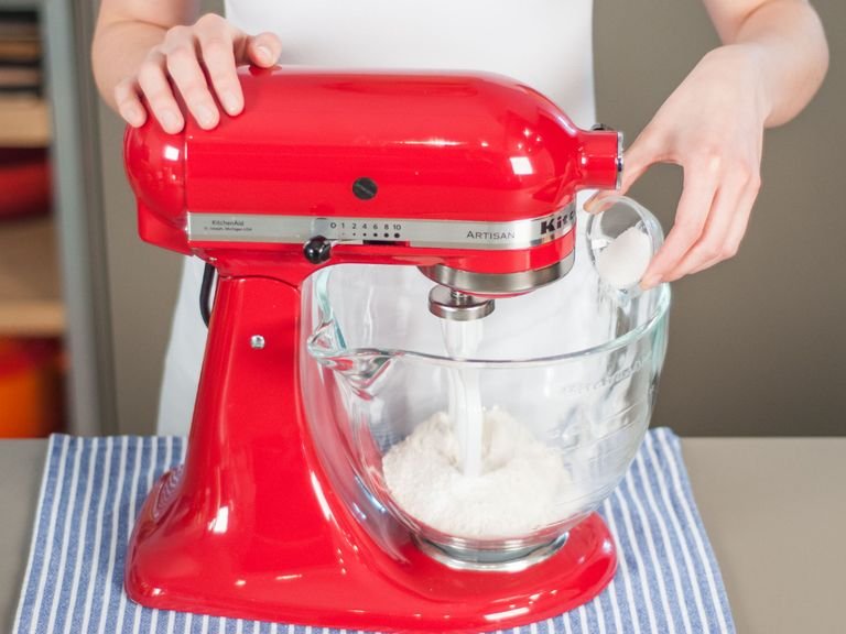In a standing mixer, combine flour, baking powder, vanilla sugar, and a pinch of salt.