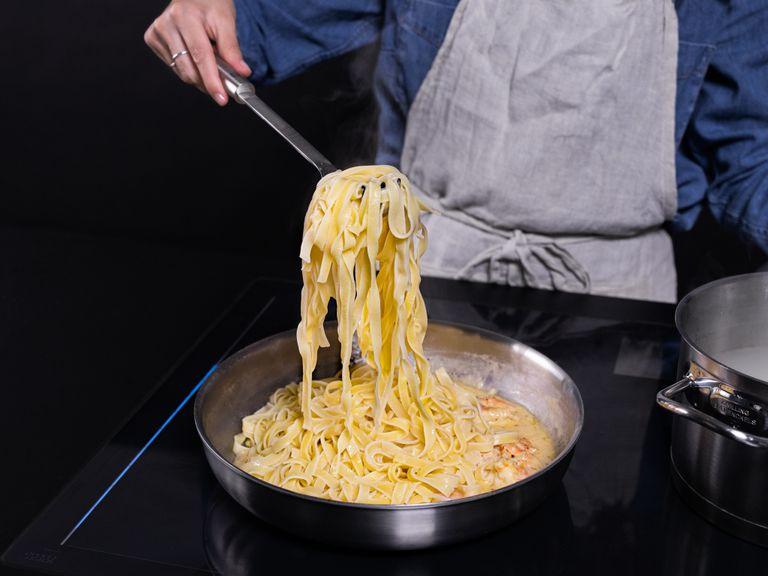 Transfer tagliatelle along with some pasta water to the large frying pan and mix everything until fully combined and creamy, adding more pasta water as needed. Garnish with chopped parsley, serve, and enjoy!