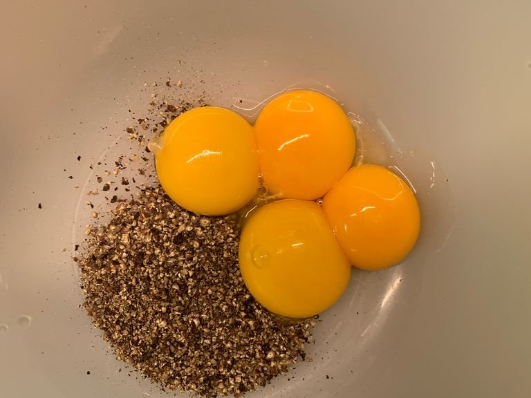 Separate egg whites and yolks and add egg yolks to a bowl with grounded pepper. I’m my case, I used four yolks because they were small. Don’t throw away egg whites, safe them for morning omelette. 