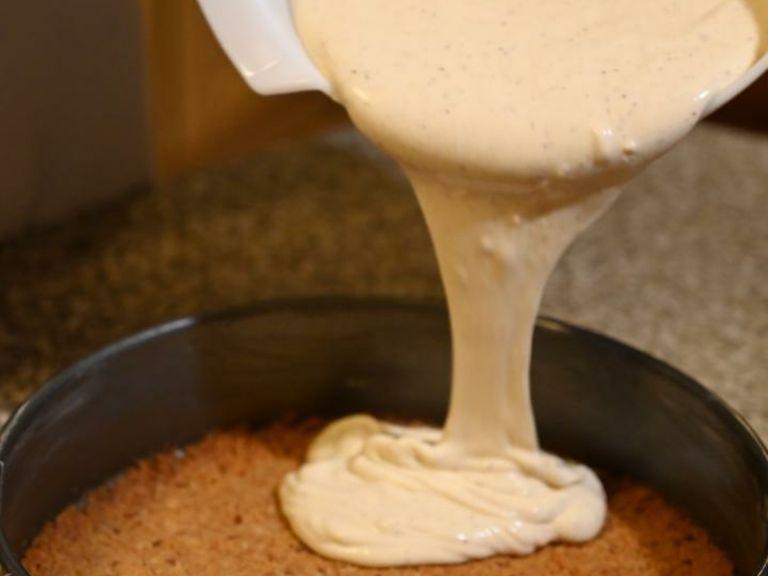 Pour the cream cheese mixture on top of the cooled biscuit crust.