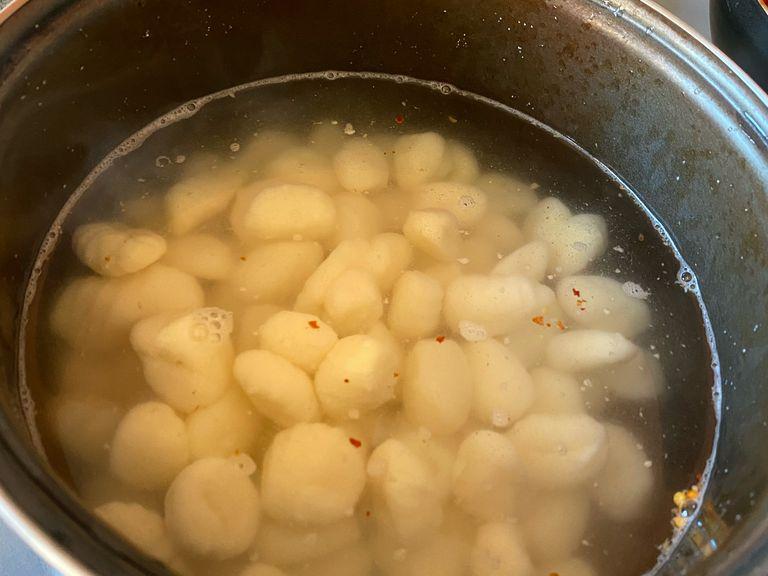 Lower the heat to a simmer and boil for 2 minutes. Give the gnocchi a poke to test the softness, but be careful not to overcook it.