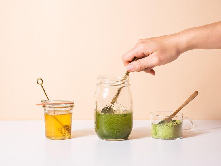 Add matcha and water to glass jar. Stir briefly, then add honey and stir again. Screw the lid onto the jar, shake well until frothy and the matcha is dissolved.