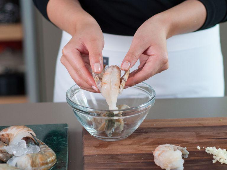 Finely mince garlic. Thinly slice basil. Peel shrimp, devein if necessary.