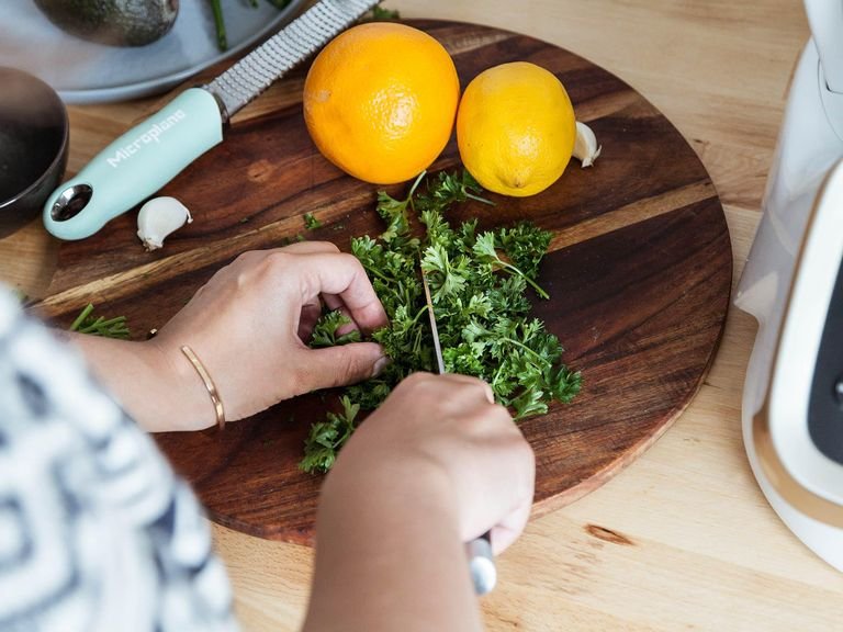 Add universal blade to the bowl of the Prep&Cook. Roughly chop parsley and add it to the bowl. Peel and cut some of the garlic into chunks. Add garlic, orange zest, lemon zest to the bowl and blend for 30 sec. on level 11. Transfer gremolata to a serving bowl and set aside.