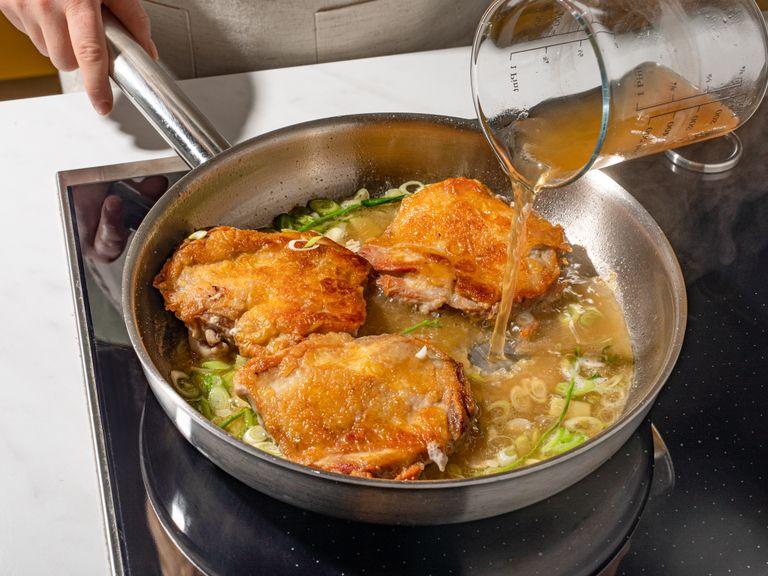 Season chicken with salt on both sides. Add oil to a cold frying pan, then add chicken immediately, placing the pieces skin-side down. Fry until skin is golden brown and crispy, approx. 12 min. Flip the chicken over and add the sliced scallions whites, tarragon stems, and ginger and fry until golden brown. Deglaze with dashi, soy sauce, and mirin and let simmer for approx. 5 min.