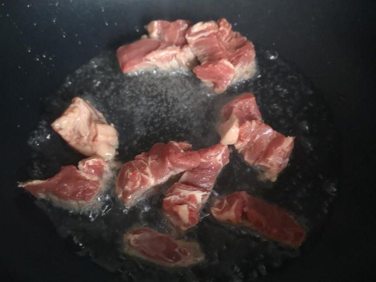 slice and sauté your beef separately, the key is to have a high heat and hot oil so that the meat fries and not boils, this will make a big difference in the texture of the meat.