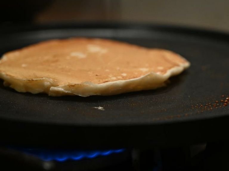 Turn the pancake over and cook for another minute or until golden in colour.