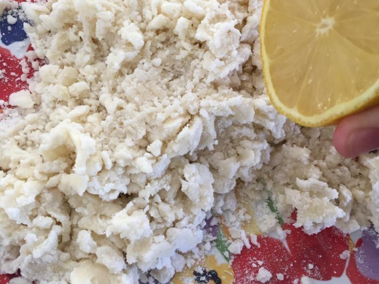 gradually add lemon juice until it forms a soft paste. Once it is soft, add more lemon juice to taste. Be carefull not to add too much, since the paste could turn liquid and not work. 