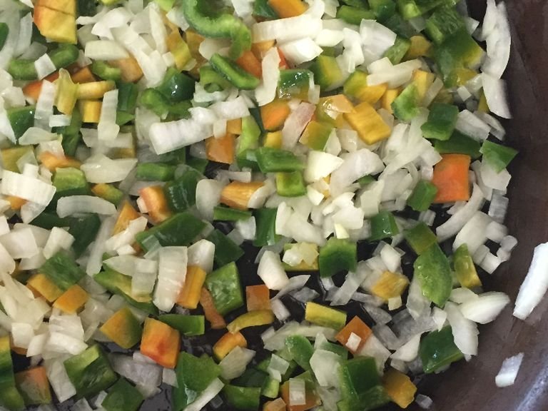 once the onion is cooked, chop bell pepper and sautée for a few minutes as well. 