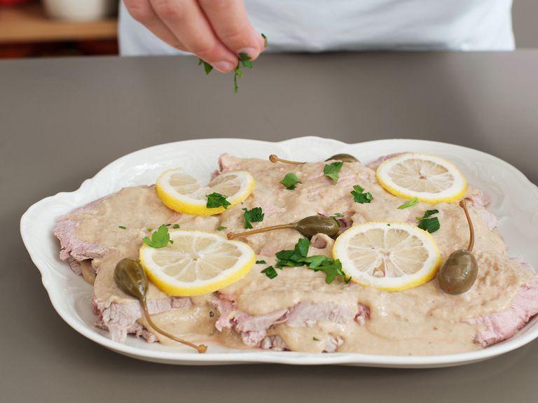 Bring dish to room temperature. Meanwhile, chop parsley and slice remaining lemon. Garnish dish with lemon slices, parsley, and capers, and serve with reserved sauce on the side. Enjoy!