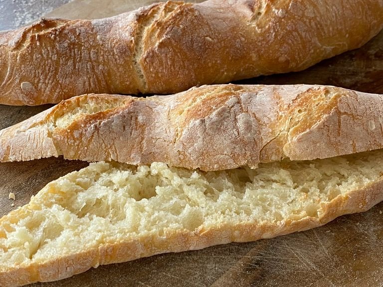 Take the baguettes out of the oven wrap in a kitchen towel let it sit for 5 minutes so the bread becomes a bit softer and easier to chew. Bon appétit