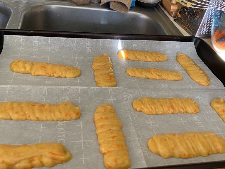Line a baking sheet with parchment paper. Add your dough into a piping bag. Pipe log shapes on the baking sheet until it is full. (Tip: dip the tip if your finger in water to lightly press down any points in the dough). Bake for 30-35 minutes.