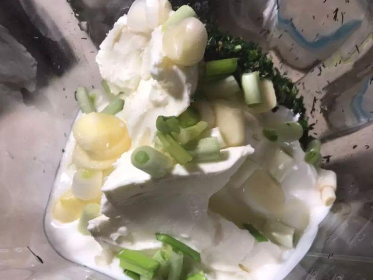 Put garlic and scallion in a blender or mixer along with the vegetables, olive oil, fresh lemon juice, yogurt and cheese.