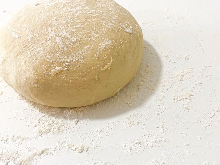 Add enough flour to make a soft dough. Knead a few times on a floured counter until smooth. Place dough in a greased bowl. Cover and let rise in a warm place until doubled.
