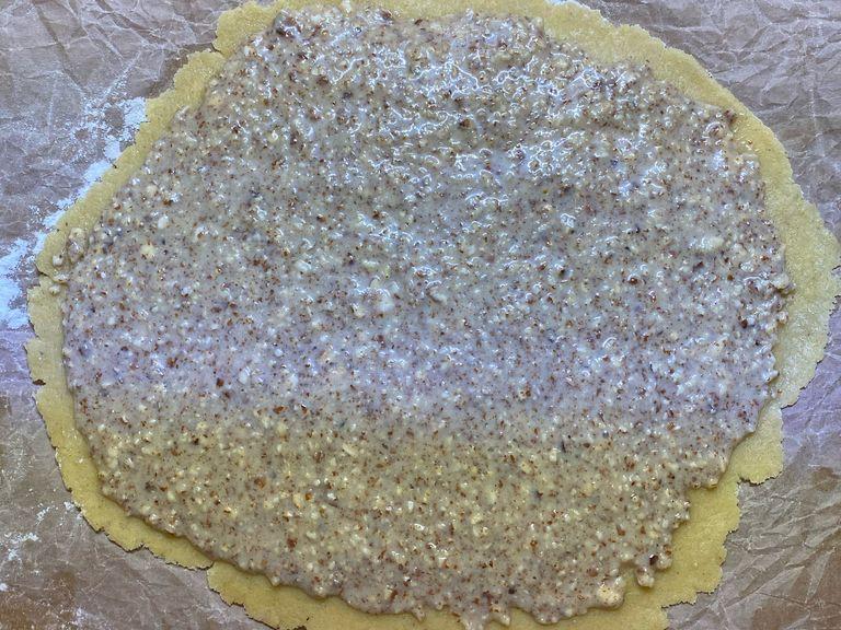 Spread the almond paste on the dough.