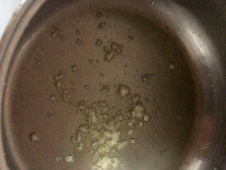 At medium heat add olive oil and prevously minced garlic and fry for one minute