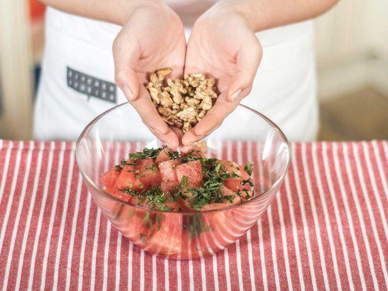 Gently break walnuts apart by hand and add to the water melon.