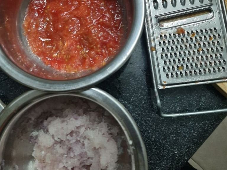 Make puree/paste from onion and tomato. If you don't have a grinder, you can simply grate the onion/tomato to get its puree.