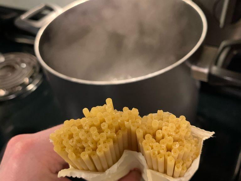 When water starts boiling, add half a package of bucatini and reduce heat to medium high to prevent boiling over. Follow cooking instructions on package. About halfway through cooking, turn heat off on pancetta.