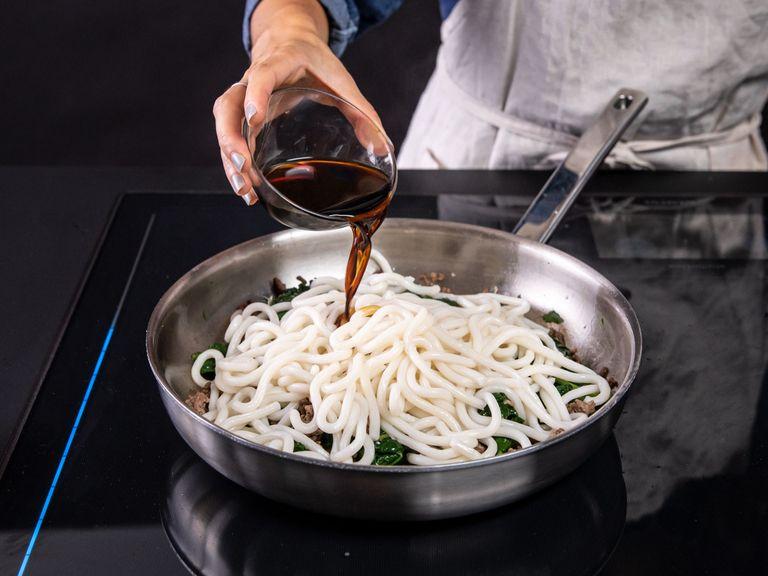 Add udon noodles and soy sauce to the pan with beef and spinach and cook, tossing constantly (and gently), until noodles are coated in a thick sauce. Serve immediately topped with sliced scallions and sesame seeds. Enjoy!