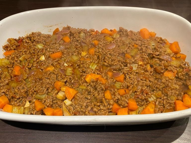 Spread beef mix in the bottom of an oven proof dish.