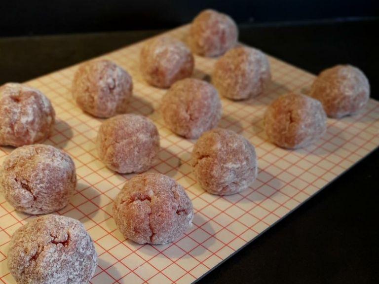 Shape the mixture into walnut-sized meatballs and roll them in flour.