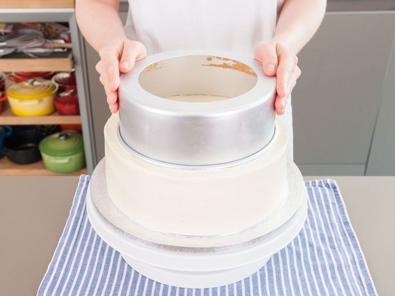 When tiers are firm, frost each with final layer of buttercream in the style you prefer. Return tiers to refrigerator to firm up for at least an hour or up to 24 hours. When tiers are firm, prepare to insert straw dowels: Measure and mark the 10-inch/25-cm tier by centering an empty 8-inch/20-cm cake pan over it and pressing down gently to mark where that tier will go. Do the same with an empty 6-inch/15-cm pan over the 8-inch/20-cm tier.