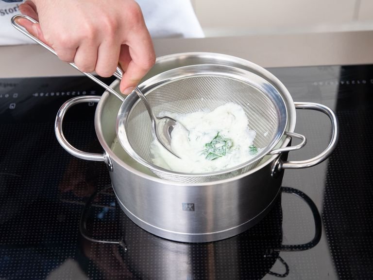 Combine the egg yolks and sugar in another pot and whisk until well combined. Strain the milk and mint mixture into the pot using a sieve. Press down on the mint leaves with the back of a spoon to extract as much flavor as possible. Whisk until well combined, set the pot over medium-high heat, and whisk the mixture until it reaches 75°C/170°F. Add a little salt to taste. Strain the custard into a refrigerator-safe container and let sit overnight.