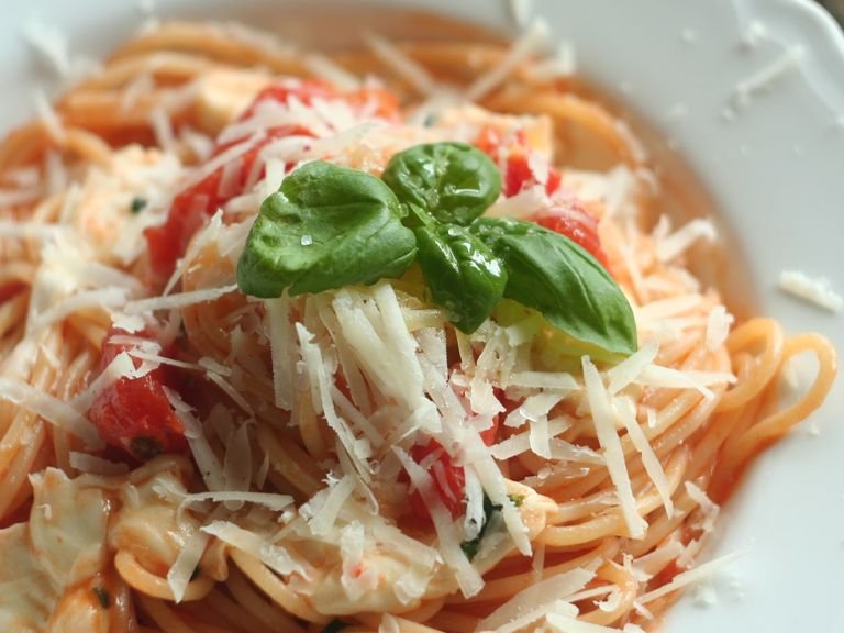 Serve with shredded pecorino or parmesan cheese, with a basil leave on top. Never forgetti moms spaghetti!