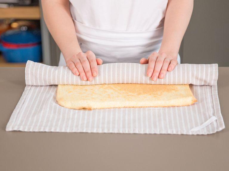 Sprinkle a bit of sugar on a clean, slightly damp kitchen towel. Place cake on top, remove parchment paper and roll up.