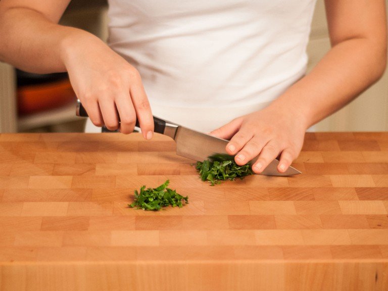 Roughly chop parsley.