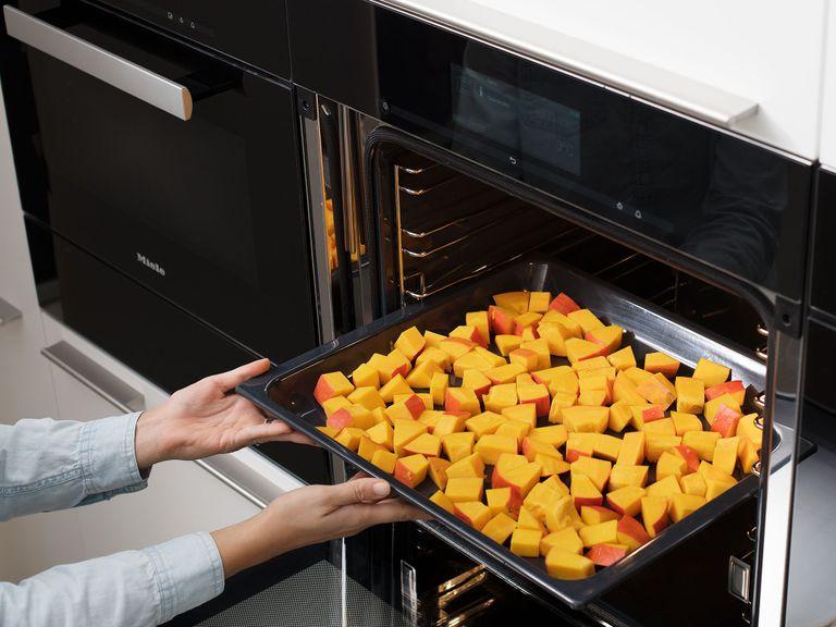 Preheat oven to 200°C/400°F. Wash the Hokkaido pumpkin, dry, and then halve. Scoop out the seeds with a spoon and then cut the pumpkin into small pieces. Place the pumpkin pieces on a baking sheet and roast for 30 min.