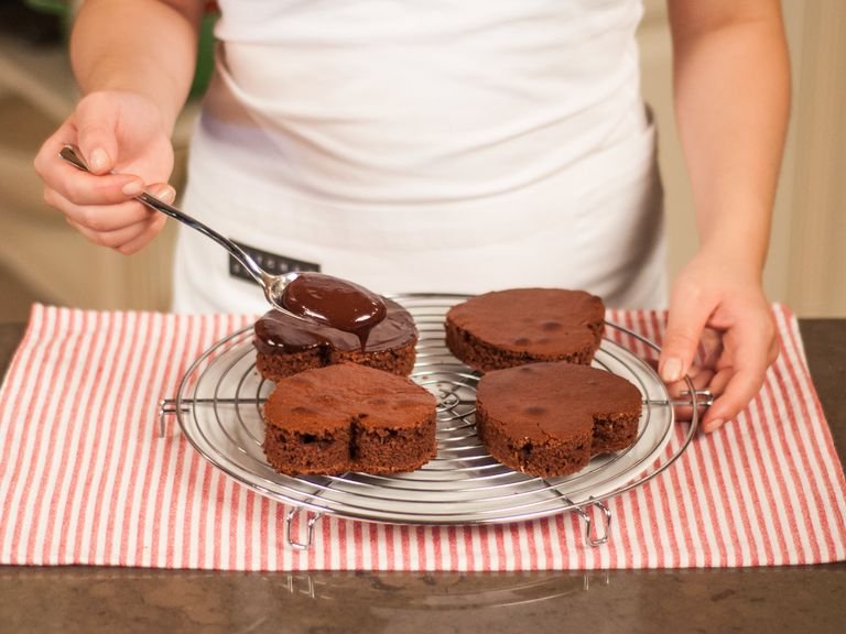 Place a plate underneath a cake rack to catch any excess ganache. Using a brush, spread ganache over the top of the cookies. Allow to set. Enjoy with your loved ones.