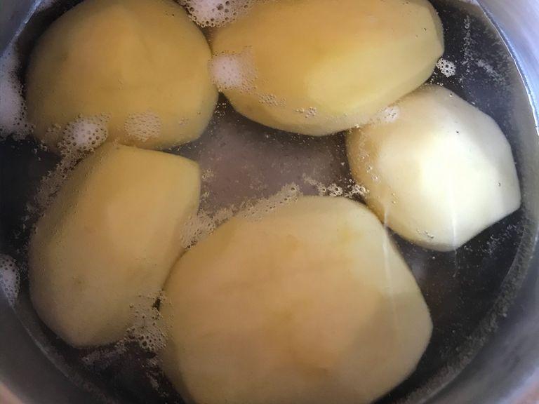 Boil the potatoes on hot water.