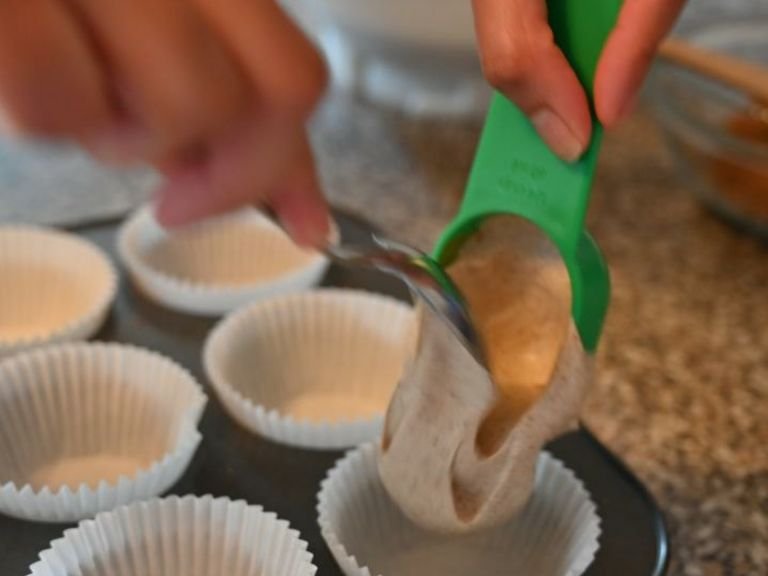 Add the cake batter to the cupcake cases.
