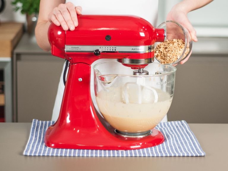 Add crushed hazelnuts to mixer and beat to combine.